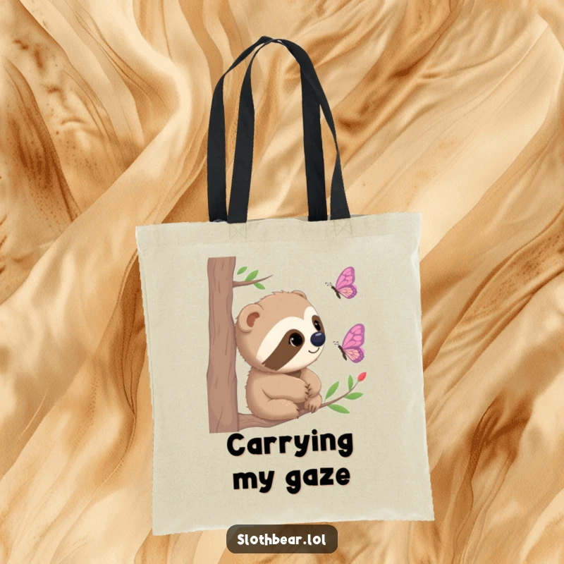 Funny Tote Bag featuring a sloth bear with curious eyes gazing at a fluttering butterfly, perfect for nature enthusiasts.